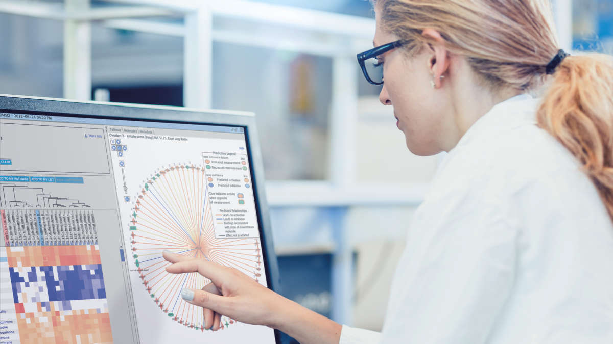 woman infront of a touchscreen