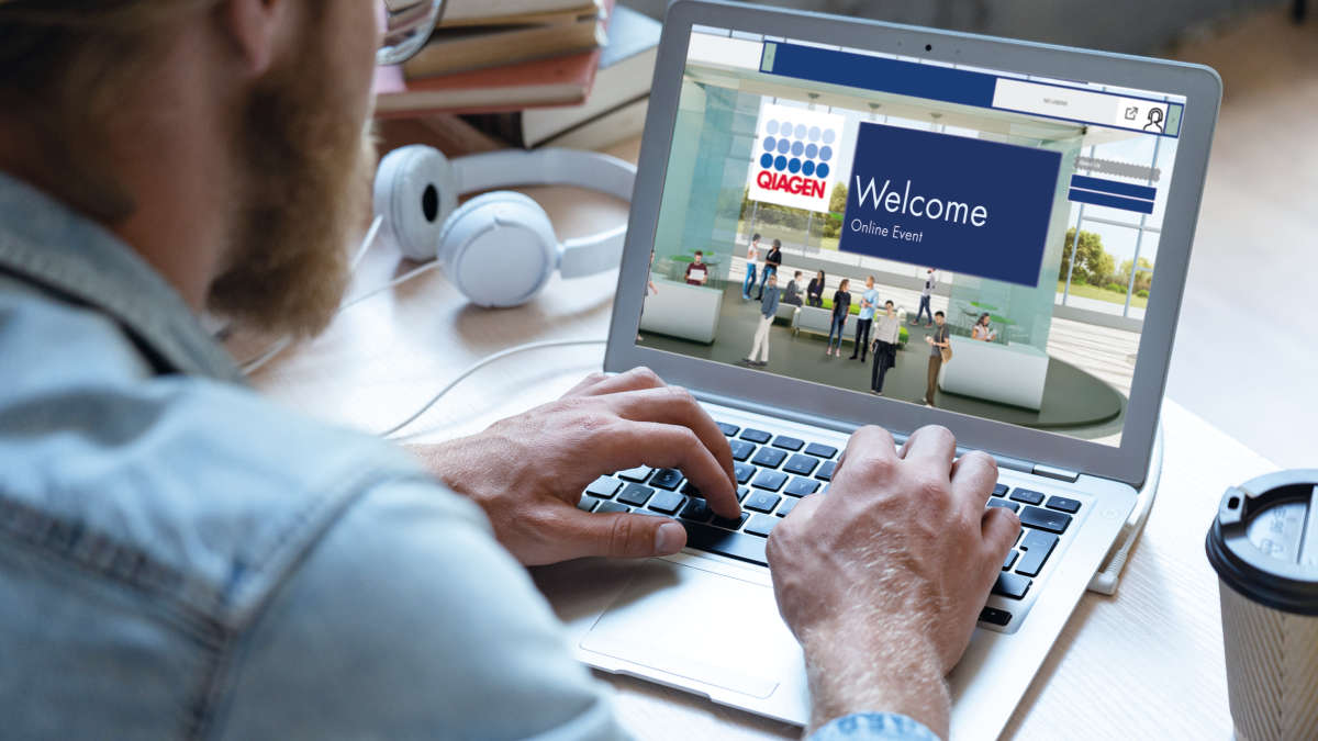 man typing on a laptop